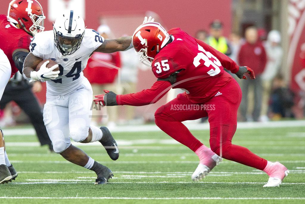 Doug Mcschooler Penn State running back Miles Sanders (24) rushes the ball out of the backfield as he's pursued by Indiana defensive lineman Nile Sykes (35) during the second half of an NCAA college football game Saturday, Oct. 20, 2018, in Bloomington, Ind. Penn State won 33-28. (AP Photo/Doug McSchooler)