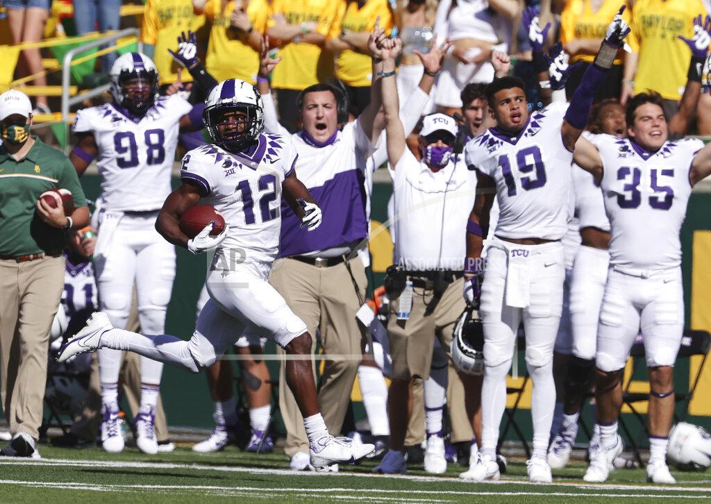 TCU wide receiver Derius Davis scores on a punt return over Baylor in the first half of an NCAA college football game, Saturday, Oct. 31, 2020, in Waco, Texas. (Rod Aydelott/Waco Tribune-Herald via AP)