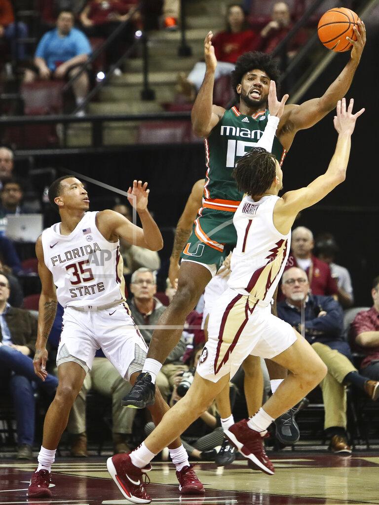 Phil Sears Miami forward Norchad Omier (15) grabs a rebound over Florida State guard Jalen Warley (1) in the first half of an NCAA college basketball game in Tallahassee, Fla., Tuesday, Jan. 24, 2023. (AP Photo/Phil Sears)