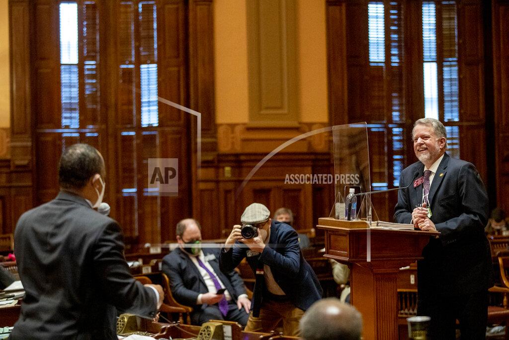 Alyssa Pointer Chairman of the House Appropriations committee Rep. Terry England, R-Auburn, answers a questions from Minority Whip Rep. David Wilkerson, D-Powder Springs, as he presents amendments to HB 80 during the Georgia legislative session at the Georgia State Capitol building in Atlanta, Thursday, Feb. 11, 2021. The amendments passed the House and the Senate. HB 80, the state's budget, was then immediately transmitted to Gov. Kemp for signing. (Alyssa Pointer/Atlanta Journal-Constitution via AP)