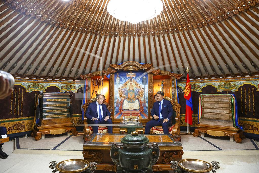 Uncredited In this photo released by Russian Foreign Ministry Press Service, Mongolian President Ukhnaagiin Khurelsukh, right, and Russian Foreign Minister Sergey Lavrov talk to each other during their meeting in Ulaanbaatar, Mongolia, Tuesday, July 5, 2022. (Russian Foreign Ministry Press Service via AP)