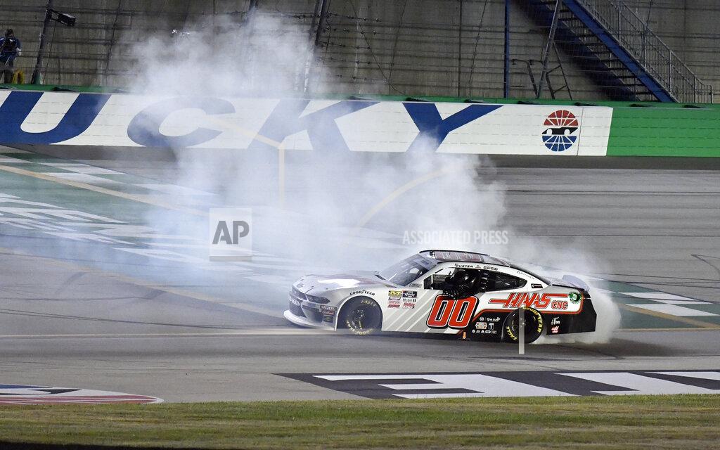 Timothy D. Easley Cole Custer (00) does a burnout on the finish line following his victory in an NASCAR Xfinity Series auto race at Kentucky Speedway in Sparta, Ky., Friday, July 12, 2019. (AP Photo/Timothy D. Easley)