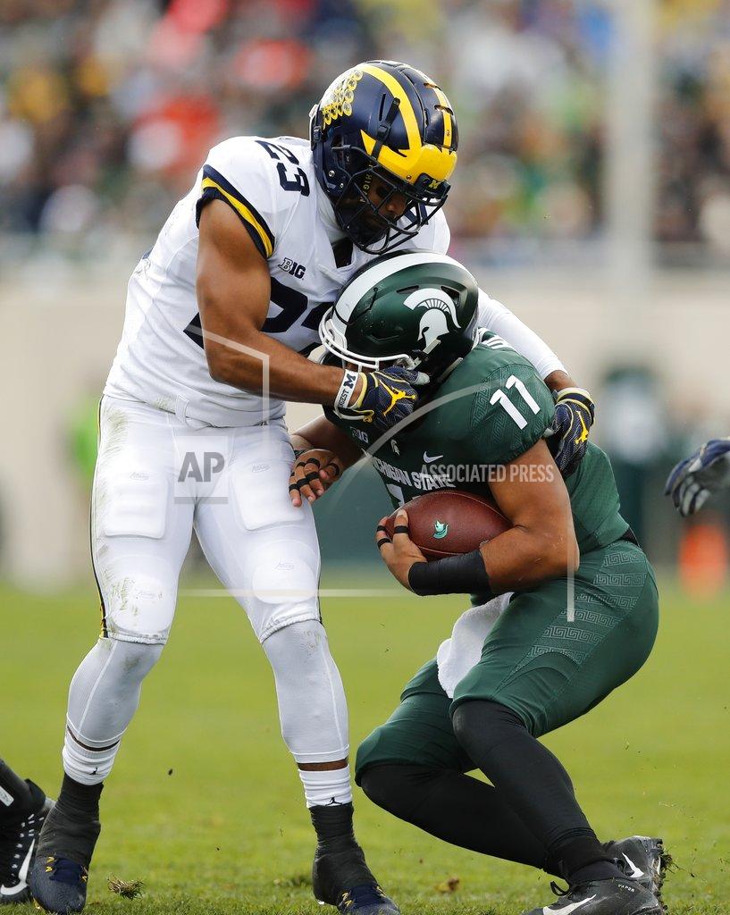 Carlos Osorio Michigan defensive back Tyree Kinnel (23) stops Michigan State running back Connor Heyward (11) during the first half of an NCAA college football game, Saturday, Oct. 20, 2018, in East Lansing, Mich. (AP Photo/Carlos Osorio)