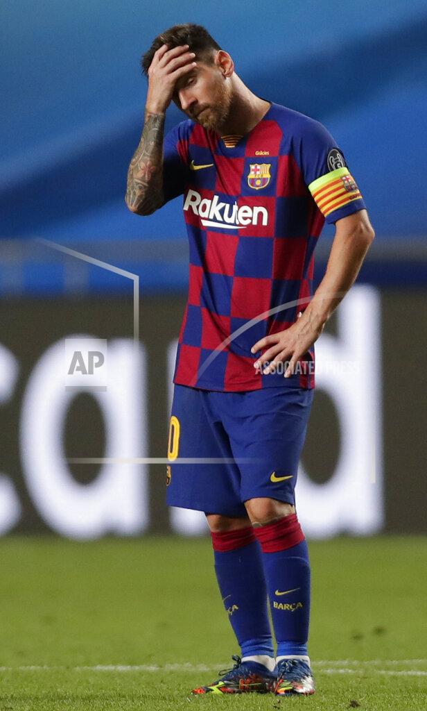 Manu Fernandez Barcelona's Lionel Messi holds his head during the Champions League quarterfinal match between FC Barcelona and Bayern Munich at the Luz stadium in Lisbon, Portugal, Friday, Aug. 14, 2020. (AP Photo/Manu Fernandez/Pool)