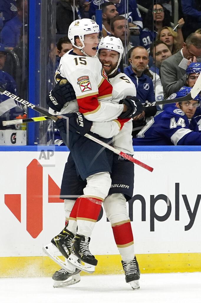 Chris O'MEara Florida Panthers center Anton Lundell (15) celebrates his goal against the Tampa Bay Lightning with defenseman Aaron Ekblad (5) during the third period of an NHL hockey game Tuesday, Oct. 19, 2021, in Tampa, Fla. (AP Photo/Chris O'Meara)