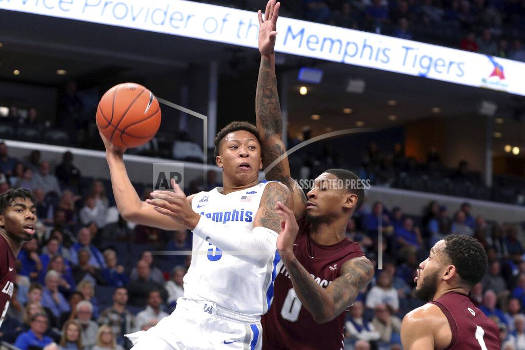 Karen Pulfer Focht Memphis' Boogie Ellis (5) is defended by Little Rock's Ben Coupet Jr. (0) during the second half of an NCAA college basketball game Wednesday, Nov. 20, 2019, in Memphis, Tenn. (AP Photo/Karen Pulfer Focht)