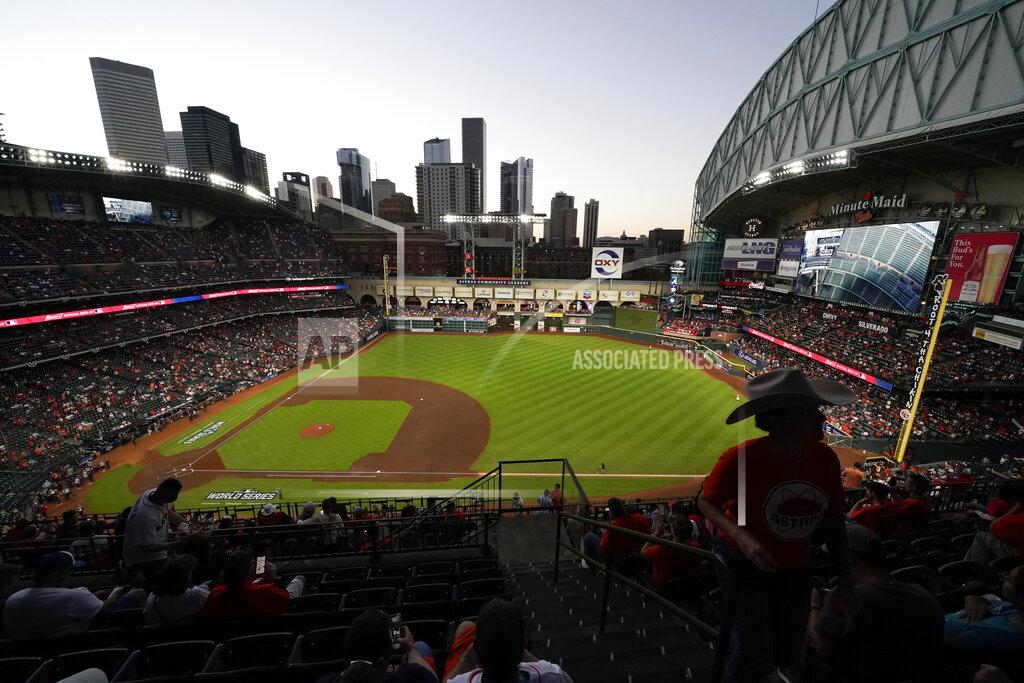 Ashley Landis FILE - Fans arrive at Minute Maid Park where the roof on the stadium was open for Game 2 of baseball's World Series between the Houston Astros and the Atlanta Braves, Oct. 27, 2021, in Houston. MLB’s labor strife showdown pits the league’s owners vs. the players with a notable third party warily watching: the fans. It is unlikely the people who actually pay for tickets will have much sympathy for either side. Fans are hoping for a quick resolution to the first MLB work stoppage in 26 years. (AP Photo/Ashley Landis, File)