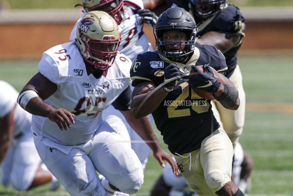 Nell Redmond Wake Forest running back Kenneth Walker III, right, runs past Elon defensive lineman Destin Flloyd on his way to scoring a touchdown in the second half of an NCAA college football game in Winston-Salem, N.C., Saturday, Sept. 21, 2019. Wake Forest won 49-7. (AP Photo/Nell Redmond)