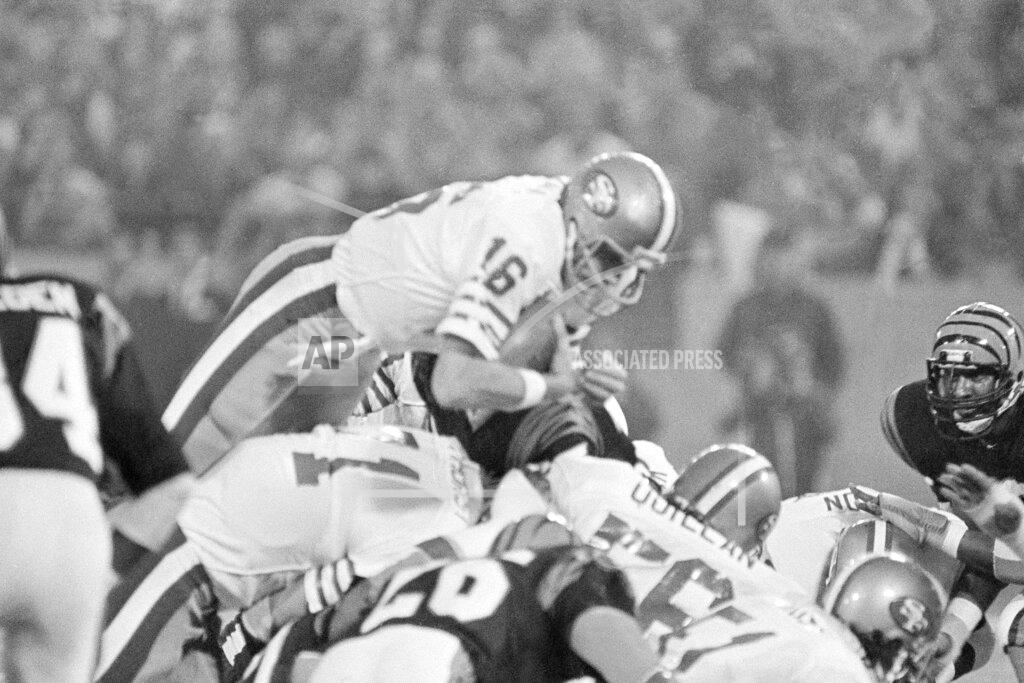 Ray Stubblebine FILE - In this Jan. 24, 1982, file photo, San Francisco 49ers quarterback Joe Montana (16) sneaks across the goal line for the 49ers first score in the first quarter of Super Bowl XVI at the Pontiac Silverdome in Pontiac, Mich. A pair of Super Bowl winning teams that launched dynasties in San Francisco and New England highlighted the list of the NFL's greatest teams, numbers 31-100. Coming in at No. 31 was the 1981 San Francisco 49ers led by coach Bill Walsh and quarterback Joe Montana. (AP Photo/Ray Stubblebine, File)