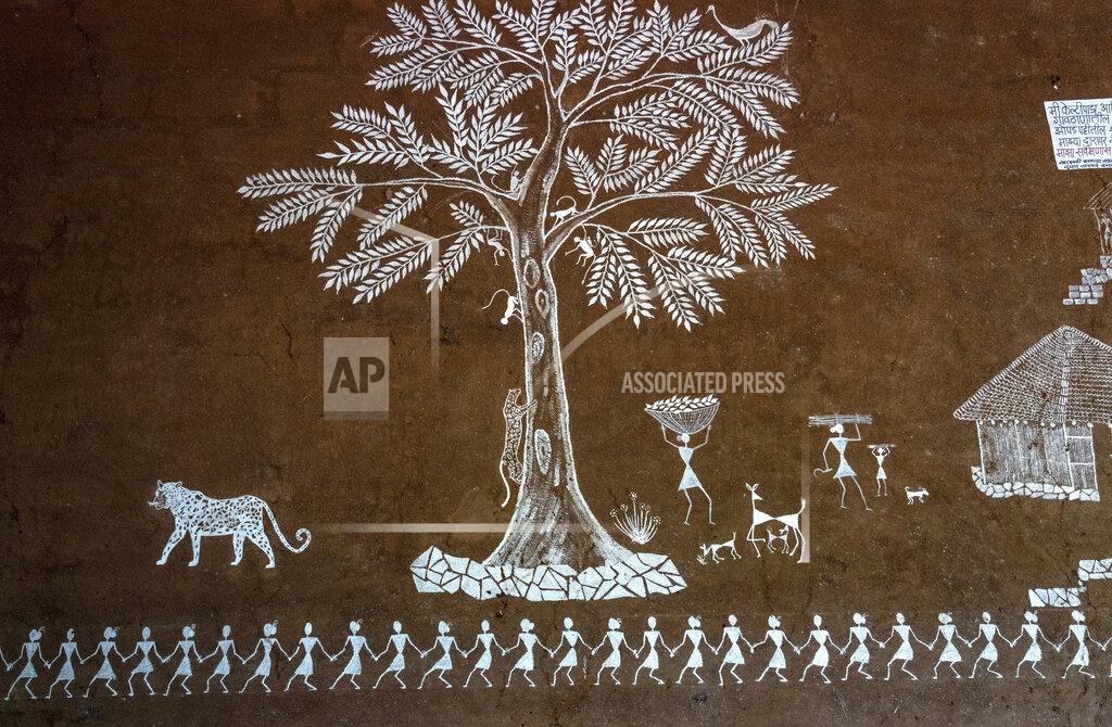 Rafiq Maqbool A wall painting of leopords is seen on the wall of a house in Aarey Colony, which borders the south end of Sanjay Gandhi National Park, in Mumbai, India, Monday, April 4, 2022.. Los Angeles and Mumbai, India are the world’s only megacities of 10 million-plus where large felines breed, hunt and maintain territory within urban boundaries. Long-term studies in both cities have examined how the big cats prowl through their urban jungles, and how people can best live alongside them. (AP Photo/Rafiq Maqbool)