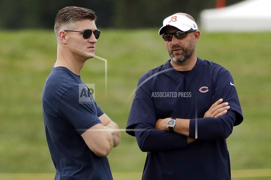 FILE - In this July 26, 2019, file photo, Chicago Bears head coach Matt Nagy, right, talks with general manager Ryan Pace during NFL football training camp in Bourbonnais, Ill. Coach Matt Nagy is ready to call plays again on offense for the Chicago Bears. Nagy said Friday, April 2, 2021, he is taking back those duties after handing them off to offensive coordinator Bill Lazor midway through last season in an effort to shake up a struggling team. Chairman George McCaskey opted to stick with Nagy and Pace, citing their leadership and the way the team handled the big losing streak last season. (AP Photo/Nam Y. Huh, File)