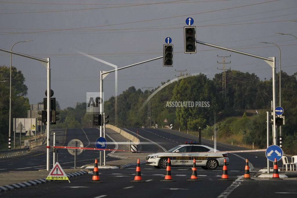 Ariel Schalit Israeli traffic police blocks a main road leading to the border with Gaza Strip, Friday, Aug. 5, 2022. The Israeli military says it is sending additional forces to the area around the Gaza Strip as it braces for possible attacks after the arrest of a senior militant in the West Bank this week. Authorities closed roads and other areas around Gaza after a raid Monday night. (AP Photo/Ariel Schalit)