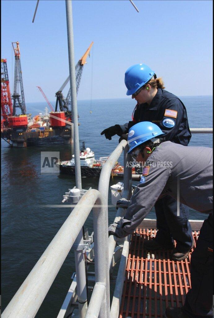 Uncredited In this July 24, 2018, released by the U.S. Bureau of Safety and Environmental Enforcement, Engineers from the U.S. Bureau of Safety and Environmental Enforcement inspect a Gulf of Mexico oil platform. Oil companies say they are better prepared for accidents 10 years after BP's Deepwater Horizon disaster, but some scientists and former agency officials say the Trump administration's move to ease safety regulations are cause for worry. (U.S. Bureau of Safety and Environmental Enforcement via AP)