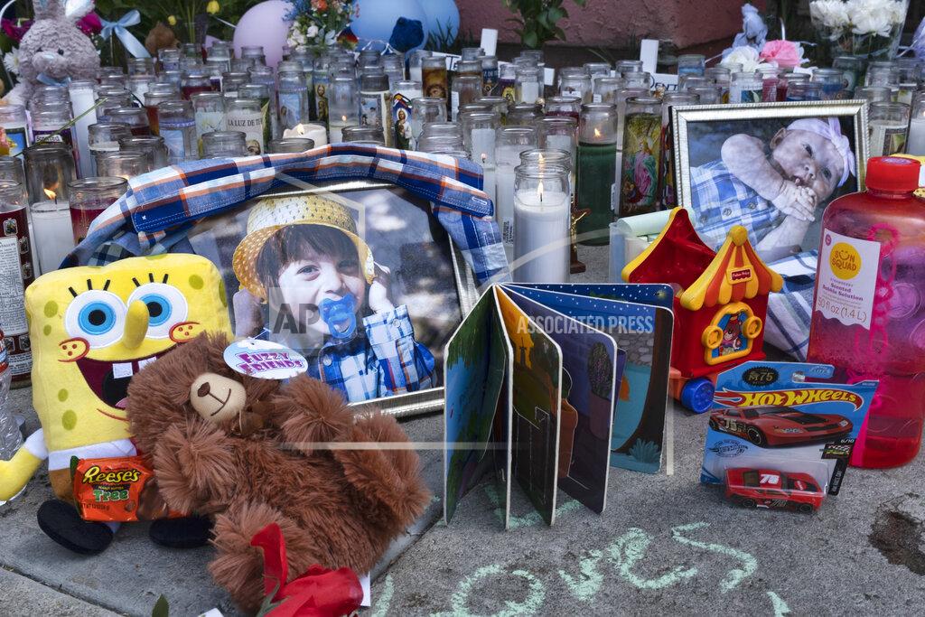 Richard Vogel FILE - In this April 12, 2021, file photo, photos, candles, flowers and balloons are placed as a memorial for three children who were killed at the Royal Villa apartments complex in the Reseda section of Los Angeles. A California woman suspected of killing her three children in the midst of a bitter custody battle said Thursday, April 15 that she drowned them to keep them away from their father, a television station reported. In a jailhouse interview, Liliana Carrillo told KGET-TV that she wanted to "protect" them from abuse, the station reported. (AP Photo/Richard Vogel, File)