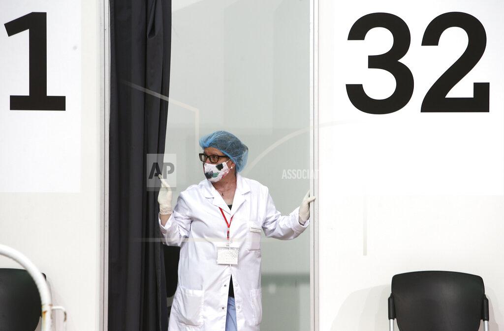 Boris Grdanoski A nurse waits at a vaccination booth, in the center for vaccination against COVID-19, at A1 Arena in Skopje, North Macedonia, on Tuesday, May 4, 2021. The European Union started delivering EU-funded coronavirus vaccines Tuesday to the Balkans, a region that wants to join the 27-nation bloc but where China and Russia have already been supplying the much-needed shots and making political gains. (AP Photo/Boris Grdanoski)