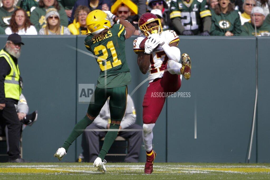 Aaron Gash Washington Football Team's Terry McLaurin catches a touchdown pass in front of Green Bay Packers' Eric Stokes during the first half of an NFL football game Sunday, Oct. 24, 2021, in Green Bay, Wis. (AP Photo/Aaron Gash)