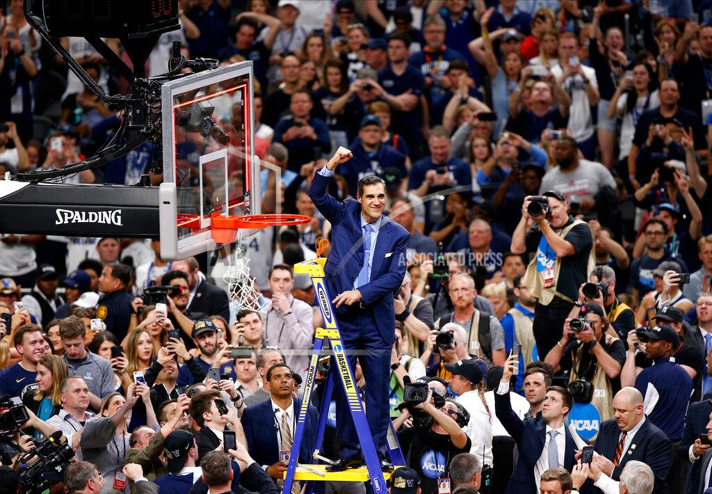 Brynn Anderson FILE - In this April 2, 2018, file photo, Villanova head coach Jay Wright reacts after cutting down the net after beating Michigan 79-62 in the championship game of the Final Four NCAA college basketball tournament, in San Antonio. (AP Photo/Brynn Anderson, File)