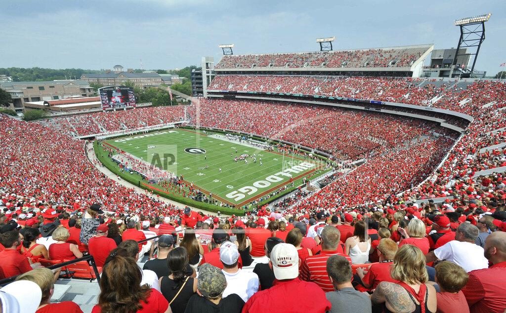 FILE - In this Sept. 5, 2015, file photo, Georgia fans watch the season opening NCAA college football game against Louisiana Monroe at Sanford Stadium n Athens, Ga. The Georgia Bulldog are planning to have fans between the hedges. The school announced ticket plans that call for allowing 20-25% capacity at 92,746-seat Sanford Stadium. (AP Photo/John Amis, File)