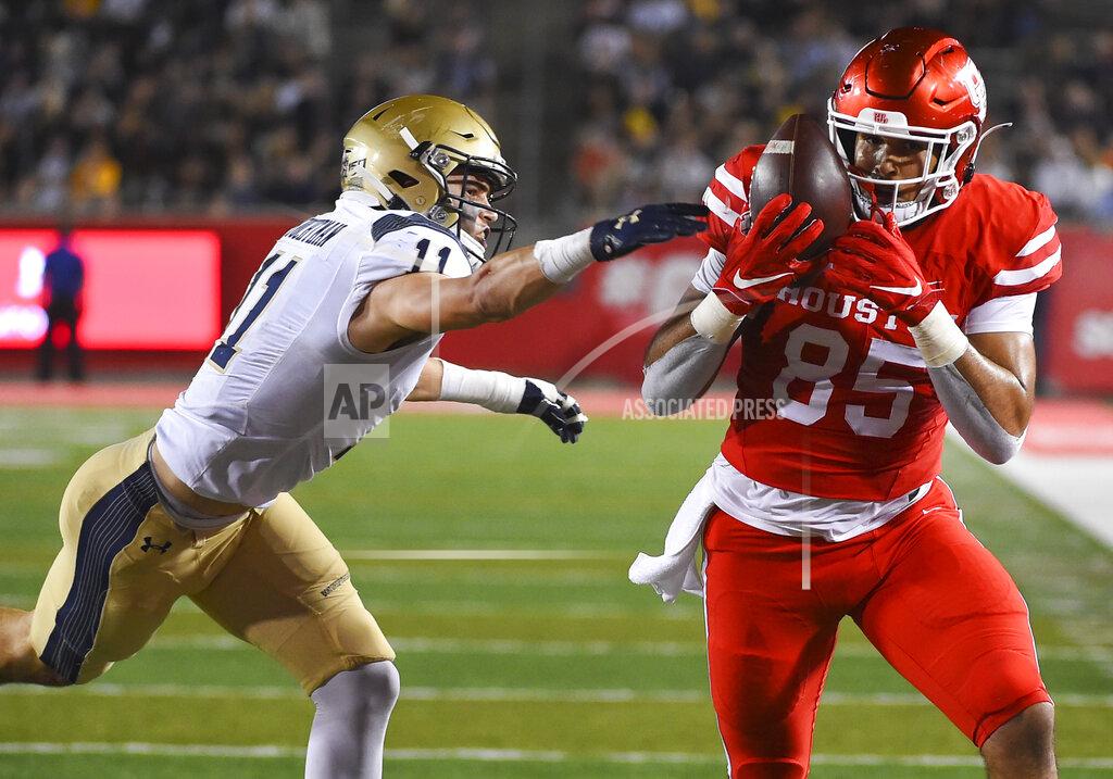 Eric Christian Smith Houston tight end Christian Trahan (85) catches a pass as Navy safety Evan Fochtman defends during the first half of an NCAA college football game, Saturday, Nov. 30, 2019, in Houston. (AP Photo/Eric Christian Smith)