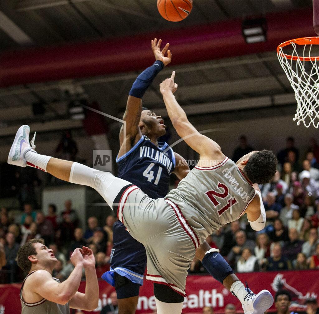 Laurence Kesterson Villanova forward Saddiq Bey (41) is fouled by Saint Joseph's forward Lorenzo Edwards (21) during the second half of an NCAA college basketball game, Saturday, Dec. 7, 2019, in Philadelphia. Villanova won 78-66. (AP Photo/Laurence Kesterson)