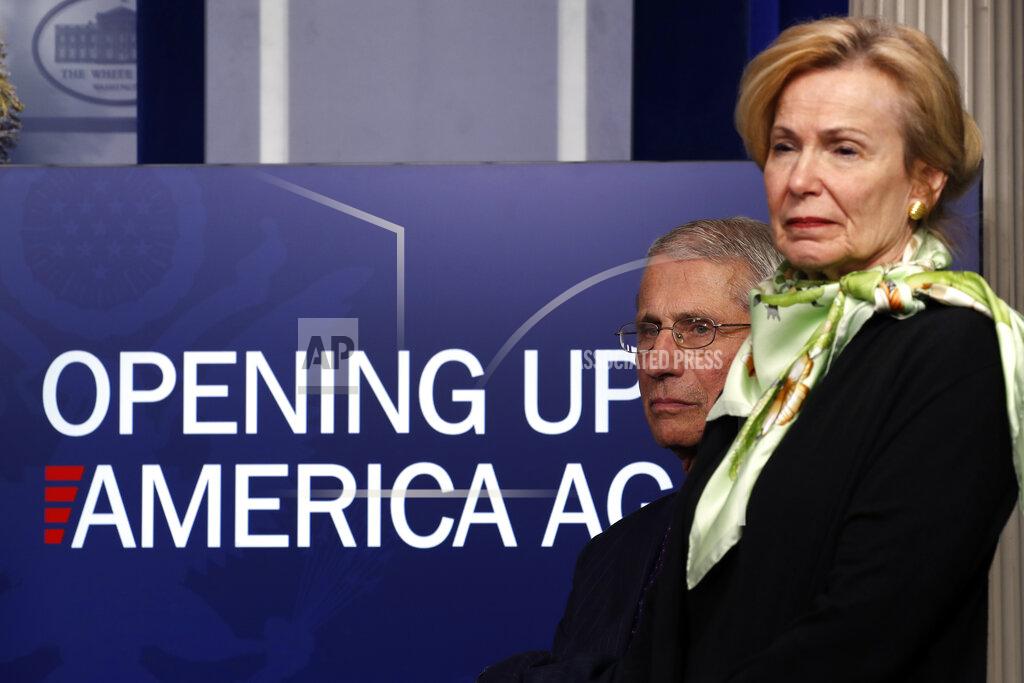 FILE - In this April 16, 2020, file photo, Dr. Anthony Fauci, director of the National Institute of Allergy and Infectious Diseases, and Dr. Deborah Birx, White House coronavirus response coordinator, listen during a briefing about the coronavirus in the James Brady Press Briefing Room of the White House in Washington. The Trump administration has shelved a set of detailed documents created by the nation’s top disease investigators meant to give step-by-step advice to local leaders deciding when and how to reopen mass transit, day care centers, restaurants, bars and other public places during the still-raging pandemic. (AP Photo/Alex Brandon, File)