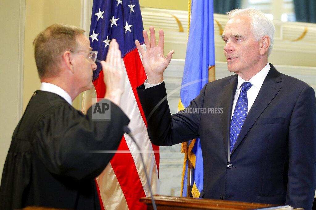 Bryan Terry John O'Connor, right, is sworn in as Oklahoma's new attorney general by Oklahoma Supreme Court Justice M. John Kane IV at the state Capitol in Oklahoma City, Friday, July 23, 2021. Gov. Kevin Stitt named 66-year-old O'Connor to the post on Friday after a two-month search. (Bryan Terry/The Oklahoman via AP)