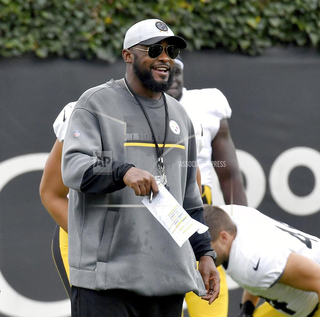 Matt Freed Pittsburgh Steelers coach Mike Tomlin talks to players as they stretch during NFL football practice Wednesday, Oct. 13, 2021, in Pittsburgh. (Matt Freed/Pittsburgh Post-Gazette via AP)