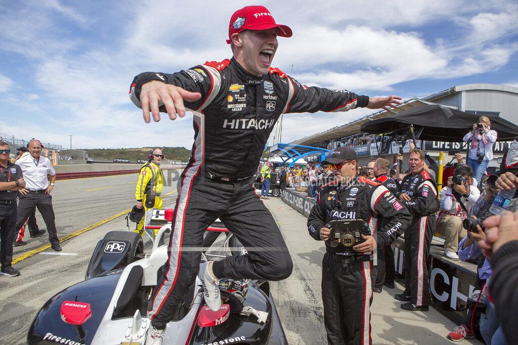 David Royal Josef Newgarden (2) jumps from his car to celebrate with his team after winning the championship after an IndyCar auto race at Laguna Seca Raceway in Monterey, Calif., Sunday, Sept. 22, 2019. (AP Photo/David Royal)