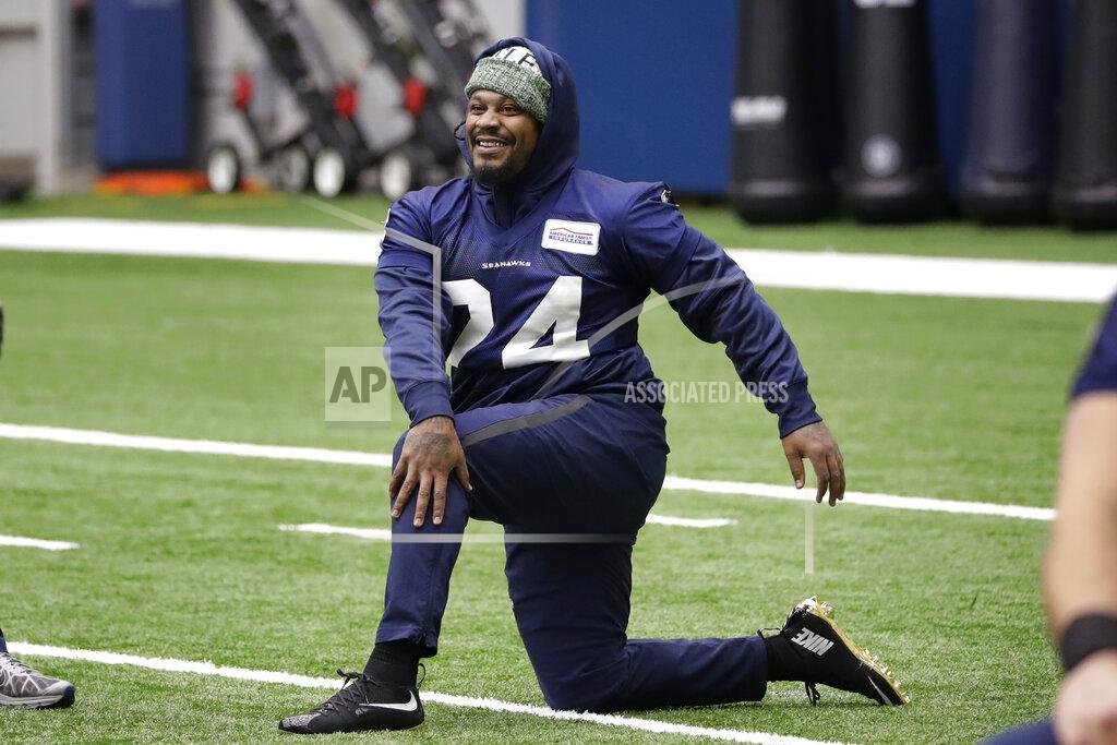 Elaine Thompson Seattle Seahawks running back Marshawn Lynch stretches during warmups at the NFL football team's practice facility Tuesday, Dec. 24, 2019, in Renton, Wash. When Lynch played his last game for the Seahawks in 2016, the idea of him ever wearing a Seahawks uniform again seemed preposterous. Yet, here are the Seahawks getting ready to have Lynch potentially play a major role Sunday against San Francisco with the NFC West title on the line. (AP Photo/Elaine Thompson)