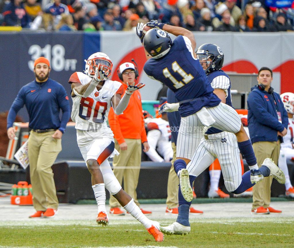 Howard Simmons Notre Dame safety Alohi Gilman (11) steps in front of Syracuse wide receiver Taj Harris (80) for interception during the first half of an NCAA college football game, Saturday, Nov. 17, 2018, at Yankee Stadium in New York. (AP Photo/Howard Simmons)