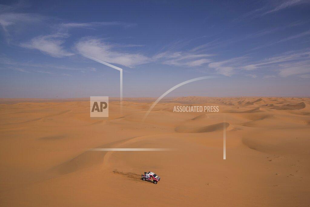 Bernat Armangue In this Sunday, Jan. 12, 2020 photo, driver Giniel De Villers, of South Africa, and co-driver Alex Haro, of Spain, race their Toyota during stage seven of the Dakar Rally between Riyadh and Wadi Al Dawasir, Saudi Arabia. Formerly known as the Paris-Dakar Rally, the race was created by Thierry Sabine after he got lost in the Libyan desert in 1977. Until 2008, the rallies raced across Africa, but threats in Mauritania led organizers to cancel that year's event and move it to South America. It has now shifted to Saudi Arabia. The race started on Jan. 5 with 560 drivers and co-drivers, some on motorbikes, others in cars or in trucks. Only 41 are taking part in the Original category. (AP Photo/Bernat Armangue)