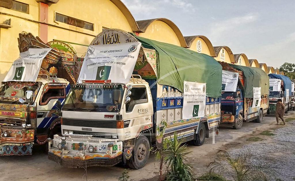 Uncredited In this photo released by Pakistan's National Disaster Management Authority, a convoy of trucks carrying relief good including tents, blankets and emergency medicines for Afghanistan's earthquake hit areas, prepare to leave for Afghanistan at a warehouse in Islamabad, Pakistan, Thursday, June 23, 2022. (National Disaster Management Authority via AP)