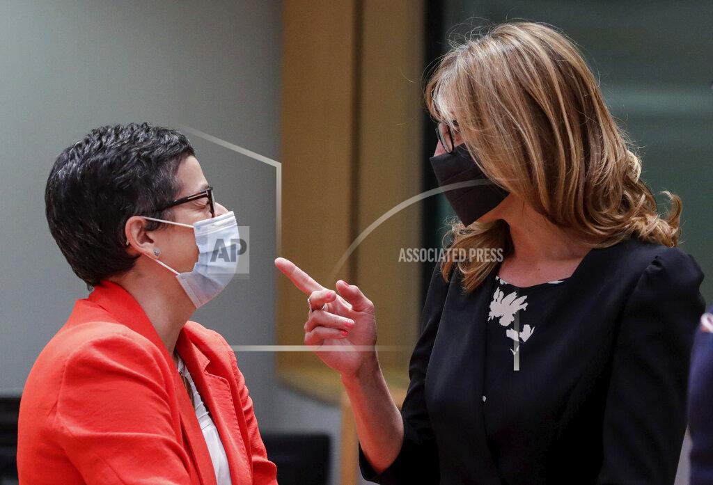 Stephanie Lecocq Spain's Foreign Minister Arancha Gonzalez, left, speaks with Bulgaria's Foreign Minister Ekaterina Zharieva during a meeting of EU foreign ministers at the European Council building in Brussels, Monday, July 13, 2020. European Union foreign ministers meet for the first time face-to-face since the pandemic lockdown and will assess their discuss their relations with China and Turkey. (Stephanie Lecocq, Pool Photo via AP)