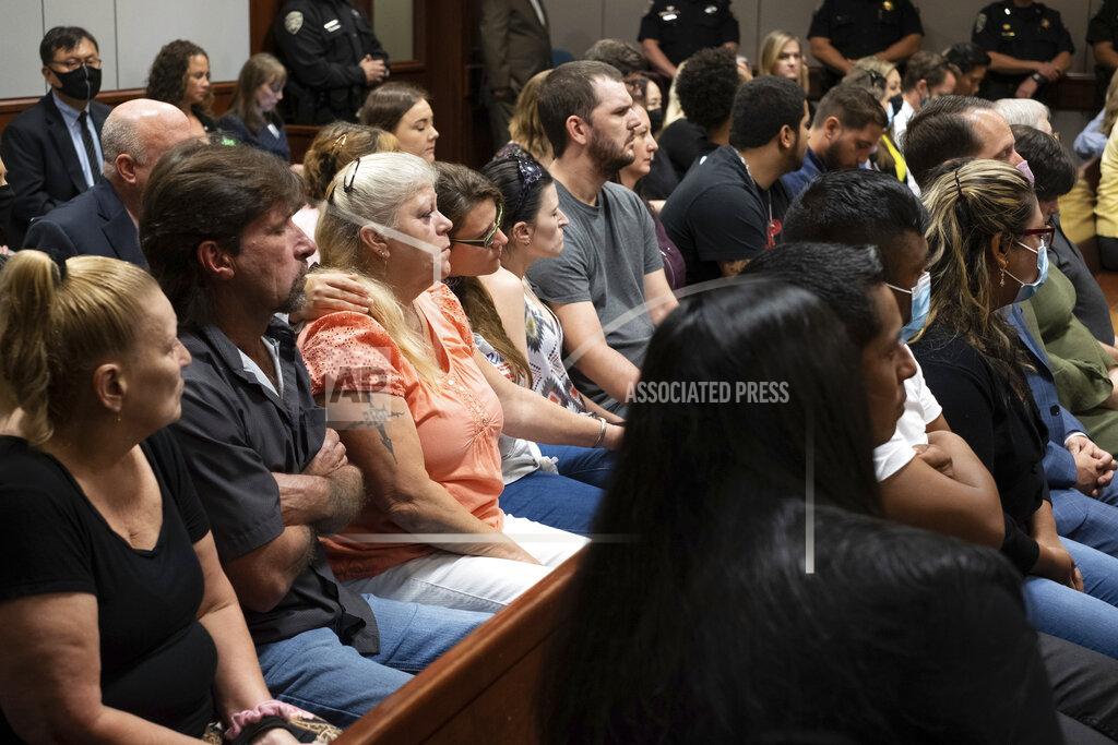 Ben Gray Friends and families of the victims listen during the plea hearing for spa shooting suspect Robert Aaron Long in Superior Court of Cherokee County in Canton, Ga. on Tuesday, July 27, 2021. The man accused of killing eight people, most of them women of Asian descent, at Atlanta-area massage businesses pleaded guilty to four of the murders. He was handed four sentences of life without parole. Robert Aaron Long still faces the death penalty in the four other deaths, which are being prosecuted in a different county. (Ben Gray/Atlanta Journal-Constitution via AP, Pool)