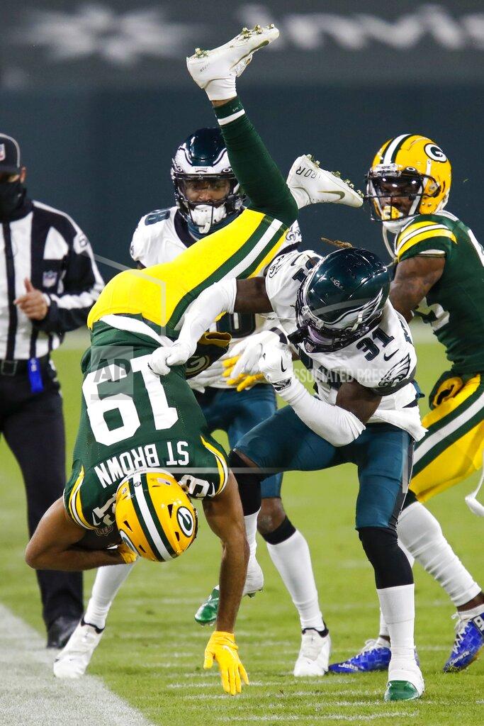 Matt Ludtke Philadelphia Eagles' Nickell Robey-Coleman tackles Green Bay Packers' Equanimeous St. Brown during the second half of an NFL football game Sunday, Dec. 6, 2020, in Green Bay, Wis. (AP Photo/Matt Ludtke)