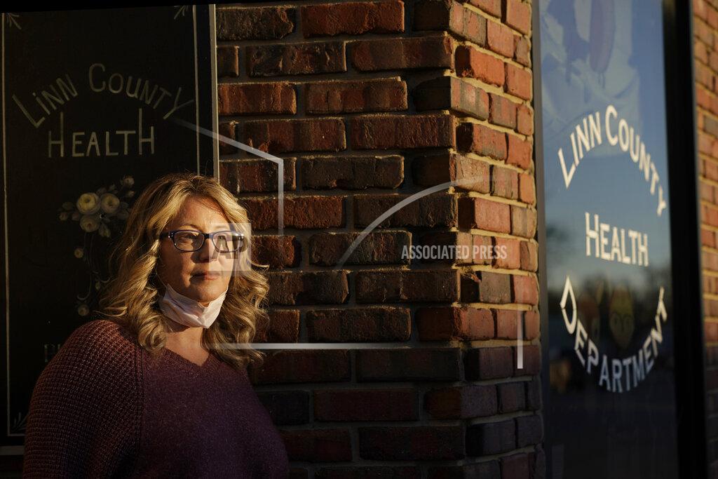 Charlie Riedel Tisha Coleman, public health administrator for Linn County, stands in front of her office Monday, Dec. 7, 2020, in Pleasanton, Kan. Across the United States, state and local public health officials such as Coleman have found themselves at the center of a political storm as they combat the worst pandemic in a century. (AP Photo/Charlie Riedel)