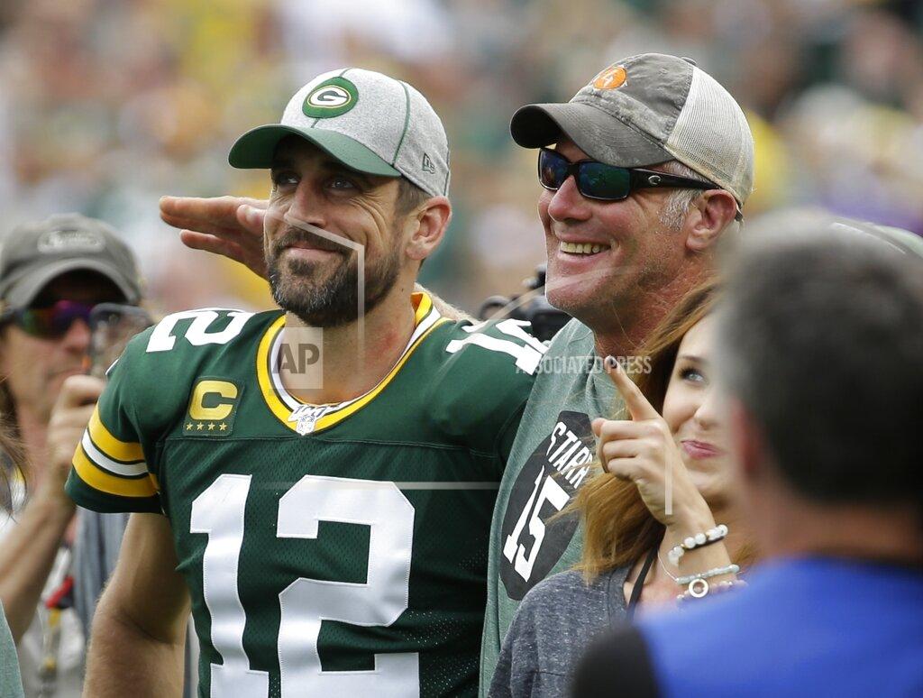 Mike Roemer Green Bay Packers' Aaron Rodgers smiles with former quarterback Brett Favre during halftime of an NFL football game against the Minnesota Vikings Sunday, Sept. 15, 2019, in Green Bay, Wis. (AP Photo/Mike Roemer)