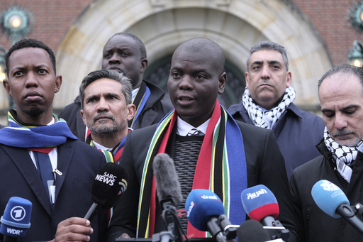 FILE - South Africa's Minister of Justice and Correctional Services Ronald Lamola, center, and Palestinian assistant Minister of Multilateral Affairs Ammar Hijazi, right, address the media outside the International Court of Justice in The Hague, Netherlands, Thursday, Jan. 11, 2024. Fighting &ldquo;human animals.&rdquo; &ldquo;No uninvolved civilians in Gaza.&rdquo; Making Gaza a &ldquo;slaughterhouse.&rdquo; These are just some of the comments made by Israeli leaders, soldiers and entertainers about Palestinians in Gaza since Hamas&rsquo; attack on Oct. 7 sparked a war with Israel. Such inflammatory rhetoric is a key component of South Africa&rsquo;s case accusing Israel of genocide at the U.N. world court, a charge Israel denies. South Africa says the language is proof of Israel&rsquo;s intent to commit genocide. (AP Photo/Patrick Post, File)