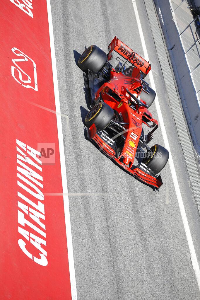 Joan Monfort Ferrari driver Sebastian Vettel of Germany drives in the pit lane during a Formula One pre-season testing session at the Catalunya racetrack in Montmelo, outside Barcelona, Spain, Tuesday, Feb. 26, 2019. (AP Photo/Joan Monfort)