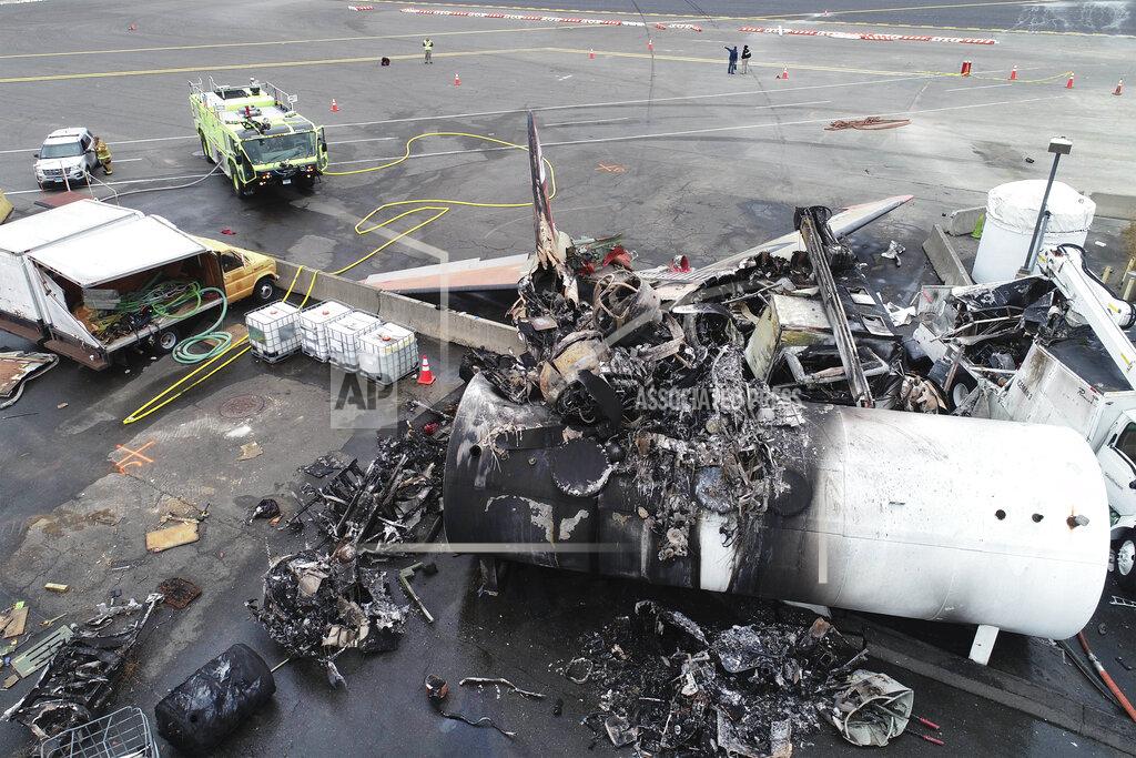 Uncredited This photo, provided by the National Transportation Safety Board, shows damage from a World War II-era B-17 bomber plane that crashed on Oct. 2, 2019, at Bradley International Airport in Windsor Locks, Conn. Pilot error was the probable cause of the 2019 crash that killed seven people and wounded six others, the National Transportation Safety Board said in a report released Tuesday, April 13, 2021, that also cited inadequate maintenance as a contributing factor. (NTSB via AP, File)