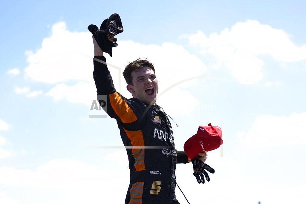 Paul Sancya Pato O'Ward celebrates after winning the second race of the IndyCar Detroit Grand Prix auto racing doubleheader on Belle Isle in Detroit, Sunday, June 13, 2021. (AP Photo/Paul Sancya)