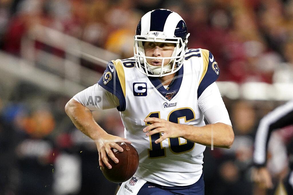 Los Angeles Rams quarterback Jared Goff rolls out to pass against the San Francisco 49ers during the first half of an NFL football game in Santa Clara, Calif., Saturday, Dec. 21, 2019. (AP Photo/Tony Avelar)