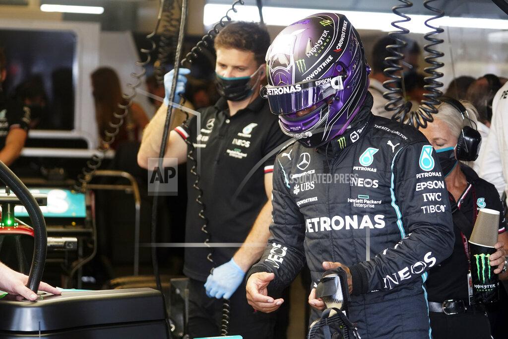 Darron Cummings Mercedes driver Lewis Hamilton, of Britain, waits to climb into his car during a practice session for the Formula One U.S. Grand Prix auto race at the Circuit of the Americas, Saturday, Oct. 23, 2021, in Austin, Texas. (AP Photo/Darron Cummings)
