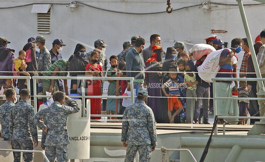 Uncredited Rohingya refugees are transported on a naval vessel to Bhashan Char, or floating island, in the Bay of Bengal, from Chittagong, Bangladesh, Friday, Dec. 4, 2020. Authorities in Bangladesh on Friday started sending a first group of nearly more than 1,500 Rohingya refugees to an isolated island despite calls by human rights groups for a halt to the process. (AP Photo).
