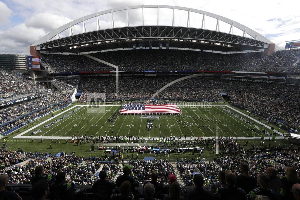 Stephen Brashear A United States flag is displayed at CenturyLink Field during the singing of the national anthem before an NFL football game between the Seattle Seahawks and the Cincinnati Bengals, Sunday, Sept. 8, 2019, in Seattle. (AP Photo/Stephen Brashear)