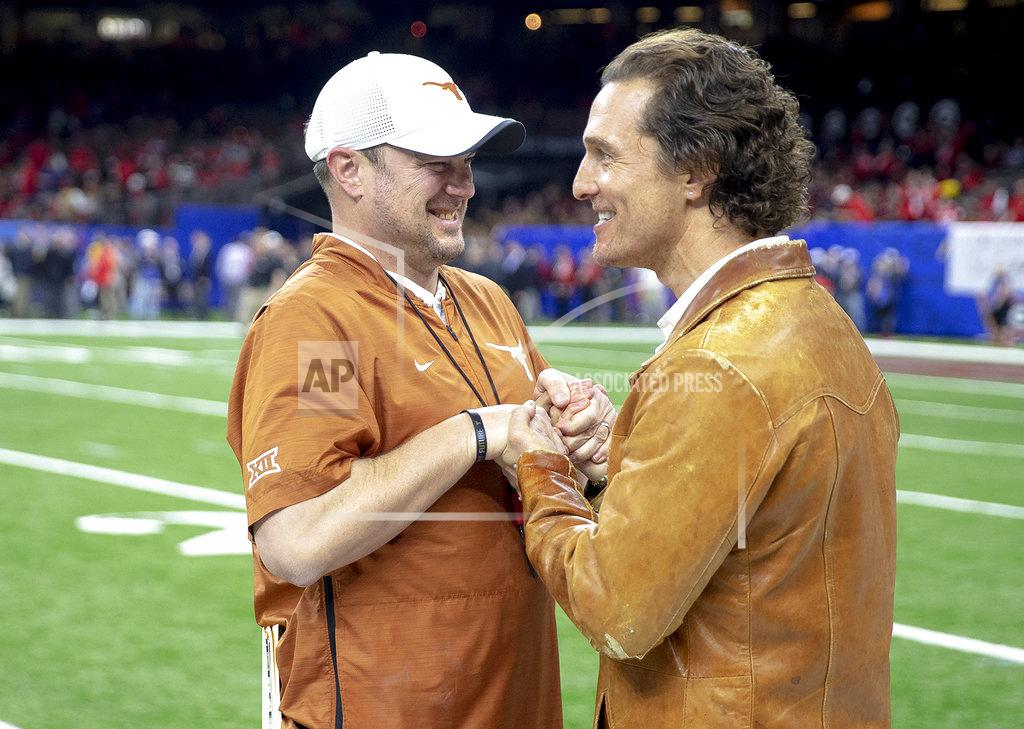 Nick Wagner Texas coach Tom Herman speaks with actor Matthew McConaughey before the team's Sugar Bowl NCAA college football game against Georgia on Tuesday, Jan. 1, 2019, in New Orleans. (Nick Wagner/Austin American-Statesman via AP)