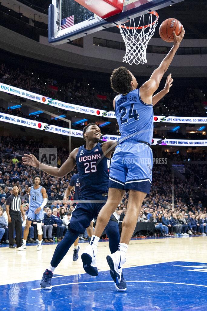 Chris Szagola Villanova's Jeremiah Robinson-Earl, right, shoots the ball with Connecticut's Josh Carlton, left, defending during the first half of an NCAA college basketball game Saturday, Jan. 18, 2020, in Philadelphia. (AP Photo/Chris Szagola)