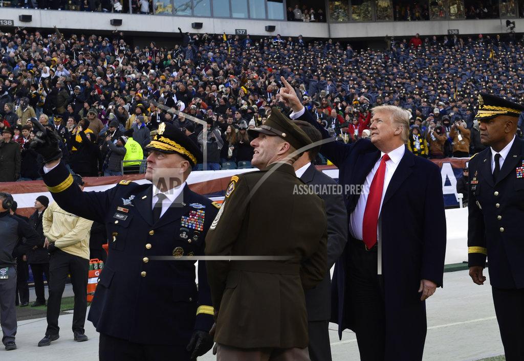 Susan Walsh President Donald Trump, second from right, watches a flyover before the start of the Army-Navy football game in Philadelphia, Saturday, Dec. 8, 2018. Army Chief of Staff Gen. Mark Milley is at left. (AP Photo/Susan Walsh)