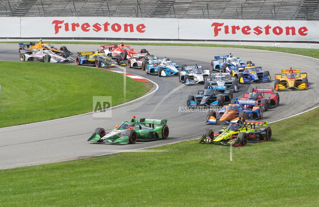 Phil Long Colton Herta (88) leads the field as Santino Ferrucci (18) runs in the grass during the start of an IndyCar Series auto race at Mid-Ohio Sports Car Course, Sunday, Sept. 13, 2020, in Lexington, Ohio. (AP Photo/Phil Long)