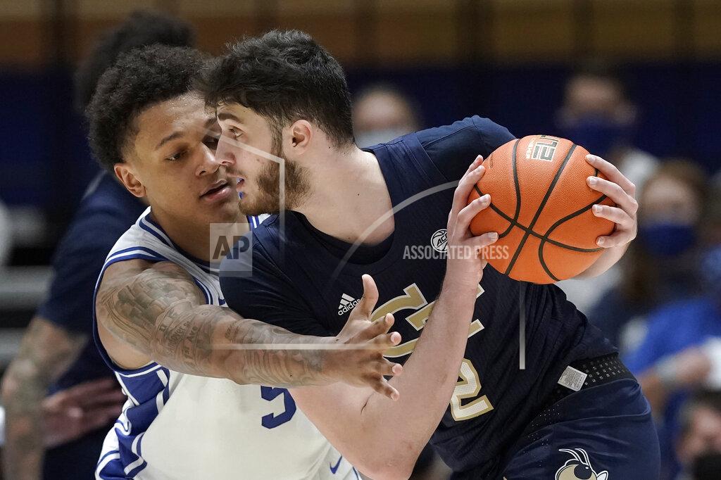 Gerry Broome Duke forward Paolo Banchero (5) guards Georgia Tech center Saba Gigiberia (2) during the second half of an NCAA college basketball game in Durham, N.C., Tuesday, Jan. 4, 2022. (AP Photo/Gerry Broome)
